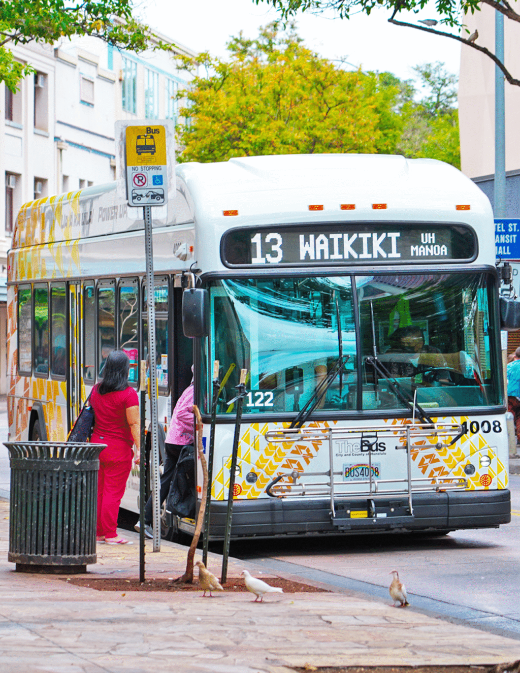 People board a local bus in Honolulu, Hawaii.
