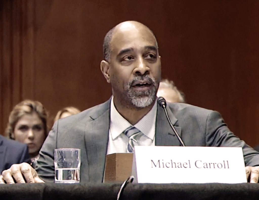 ACTO Board President, Mike Carroll from the City of Philadelphia, sitting at a table, testifying to the Senate Environment and Public Works Committee