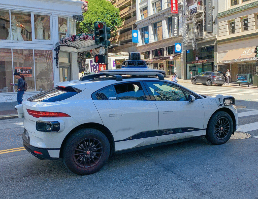 Waymo autonomous, driverless sport utility vehicle operating on the streets of San Francisco