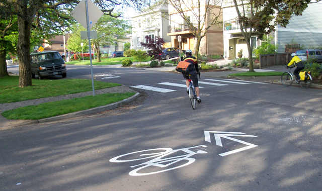 Shared Lane Marking Turn Arrow – Portland, ORA modified shared lane marking clearly shows how to follow a bicycle boulevard route.